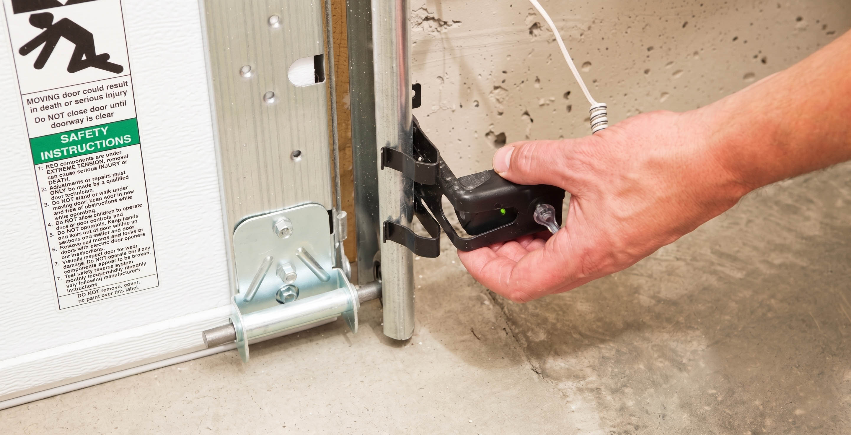 How to Fix Misaligned Garage Door Sensors and Reset Your Opener After a Power Outage — article cover image.