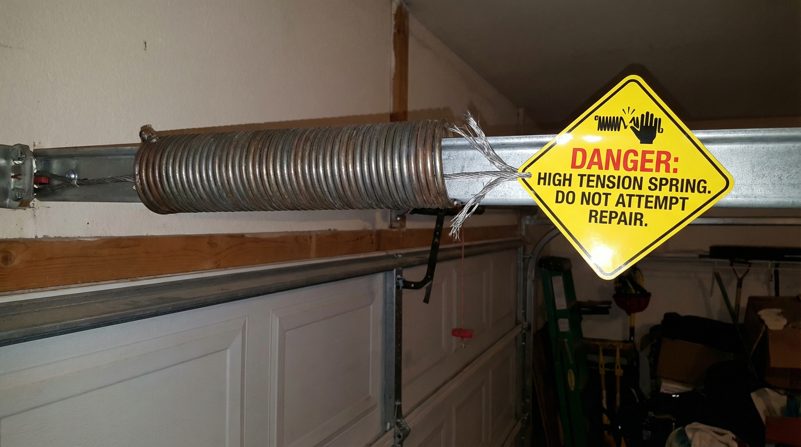 Can You Safely Open a Garage Door Manually with a Broken Spring? — article cover image.